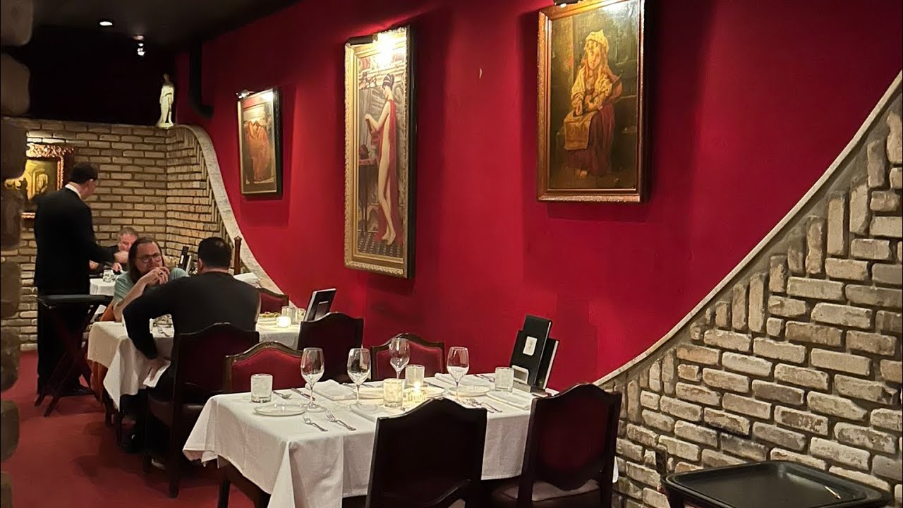 Bern's Steak House in Tampa, Florida. White table cloths, candles and its own wine cellar!!