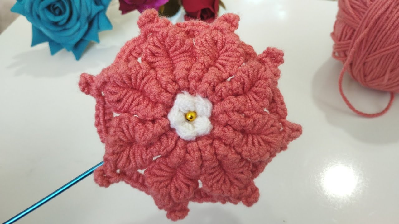How to Make a Beautiful Flower in just a few minutes using simple knitting stitches.