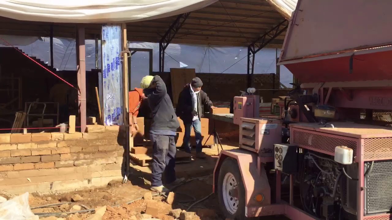 AECT 3500 compressed earth block machine producing 10