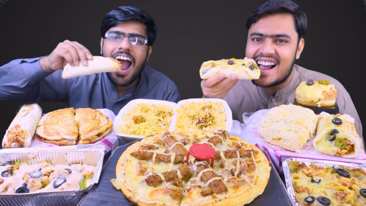 Eating Bihari Kabab Pizza, BBQ Toasties, Biryani, Dhurmat Roll, Pizza Paratha, Pizza Burger