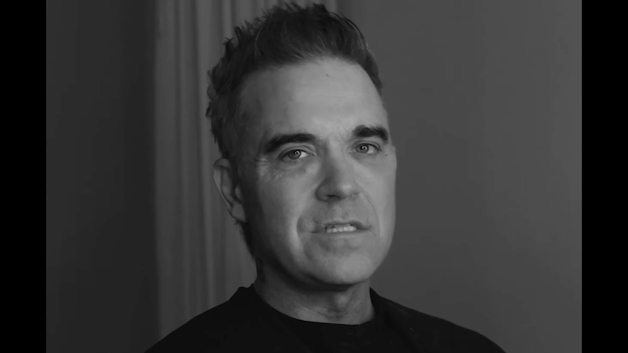 ROBBIE DOES JOEY/ Shut Up and Sing lyric video by Robbie Williams
