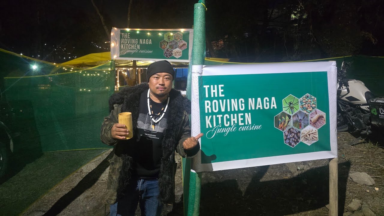 Jungle man selling salt rice beer and Jungle delicacies at Hornbill festival .