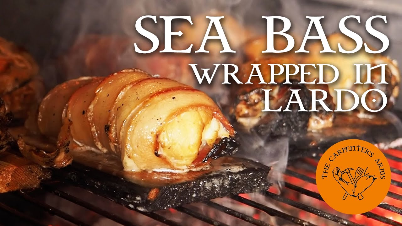 SEA BASS WRAPPED IN LARDO | Cooked on a South African Braai