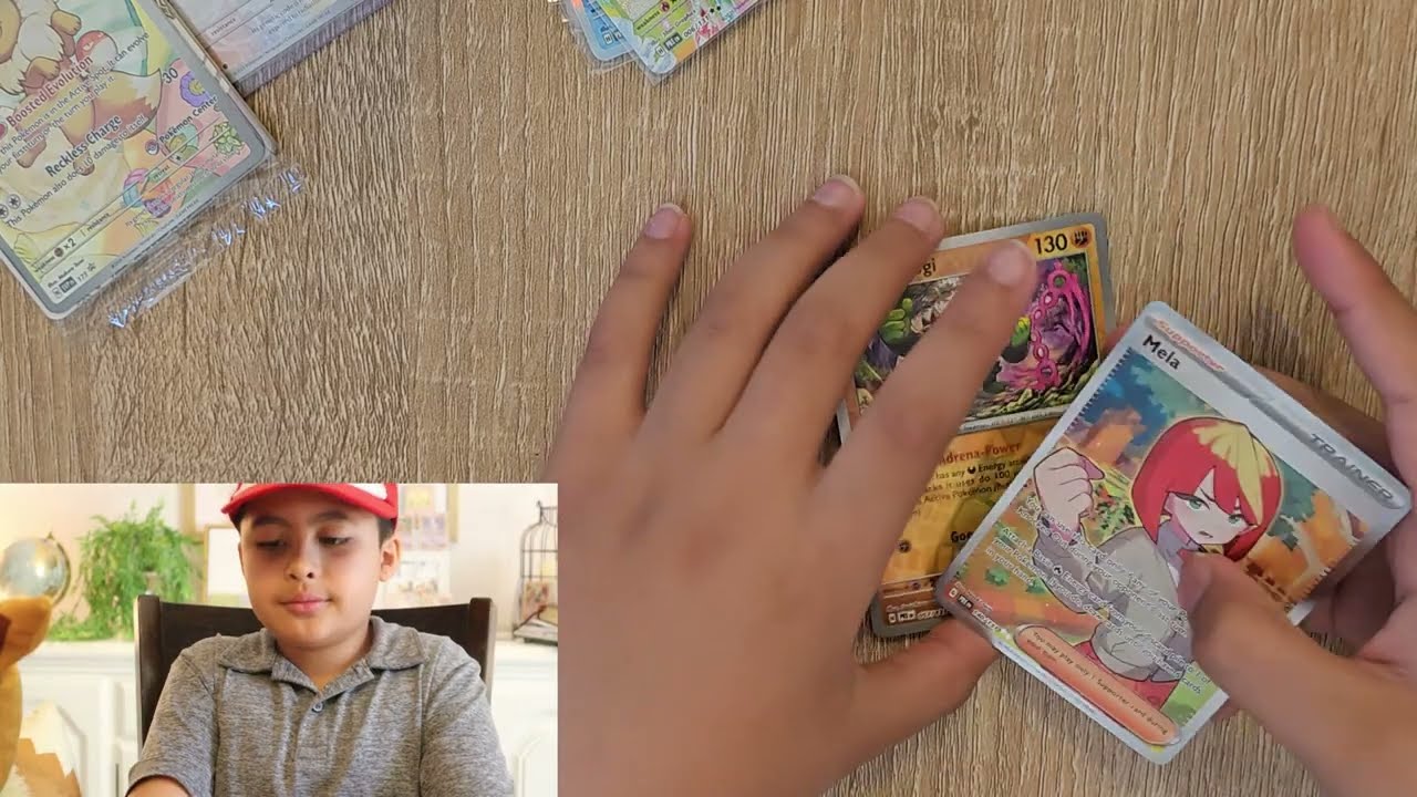 Opening Two Prismatic Evolutions Surprise Boxes and Tins.