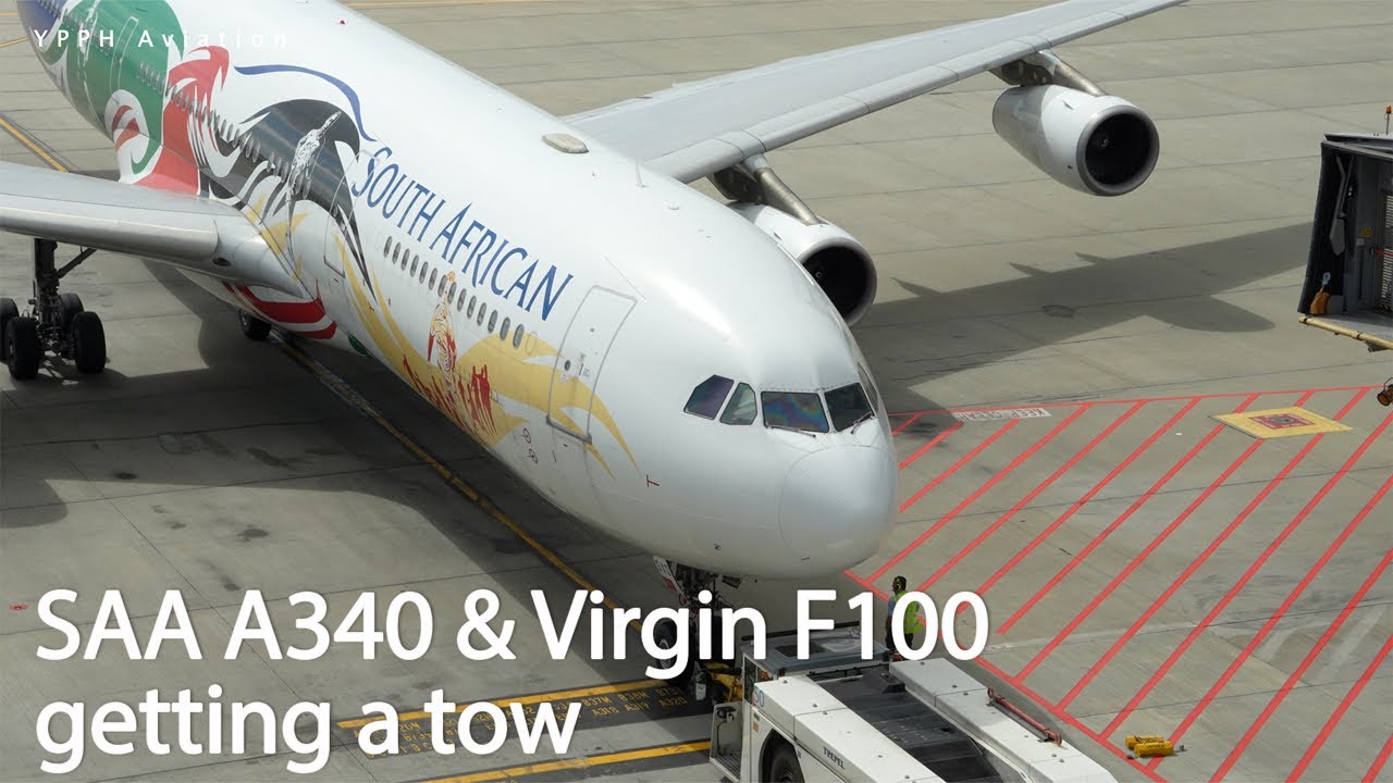 South African A340 and Virgin F100 getting towed around T1 at Perth Airport.