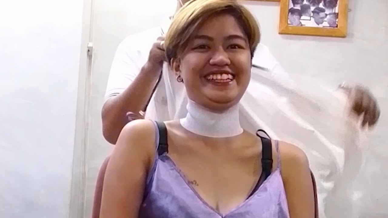 Cute girl loves the barber shop