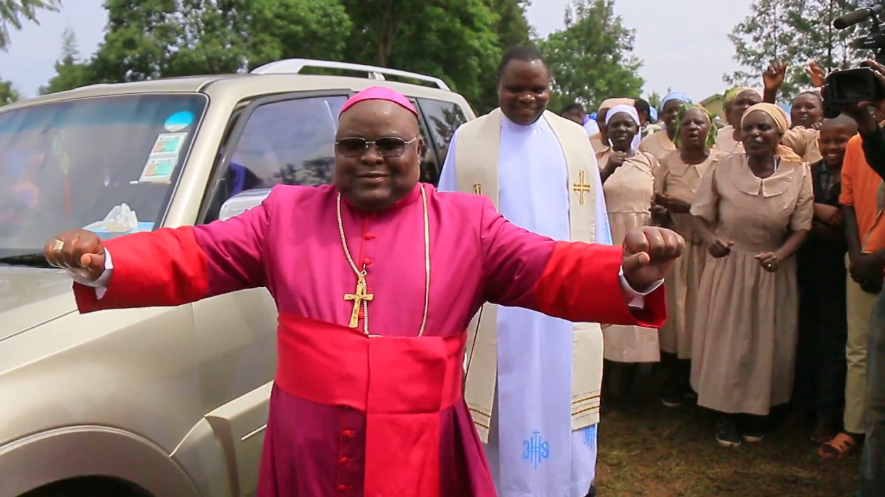 Kisii Diocese Bishop Joseph Mairura dancing to a traditional music at Nyamagwa parish.