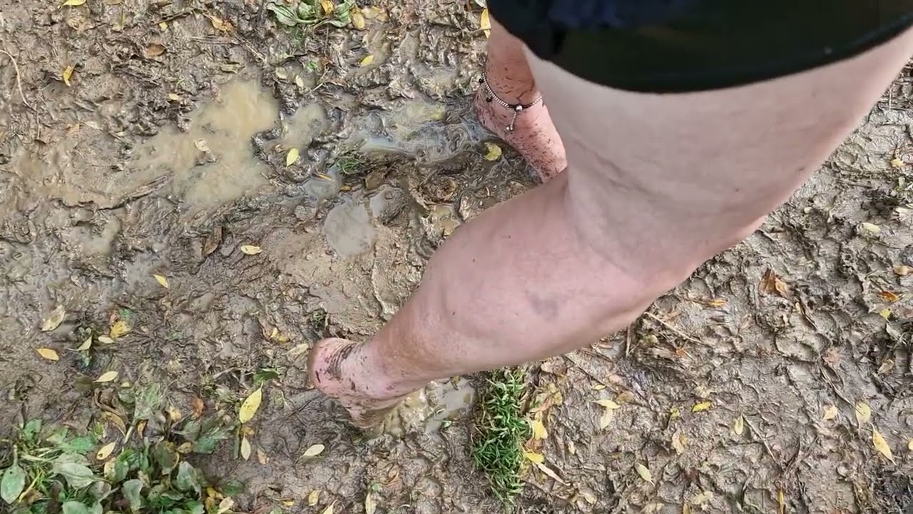 cute pvc mini skirt with muddy barefeet and legs