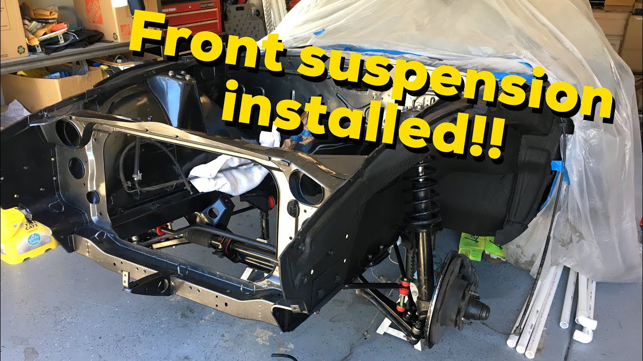 Front suspension gets installed on the Datsun 240z