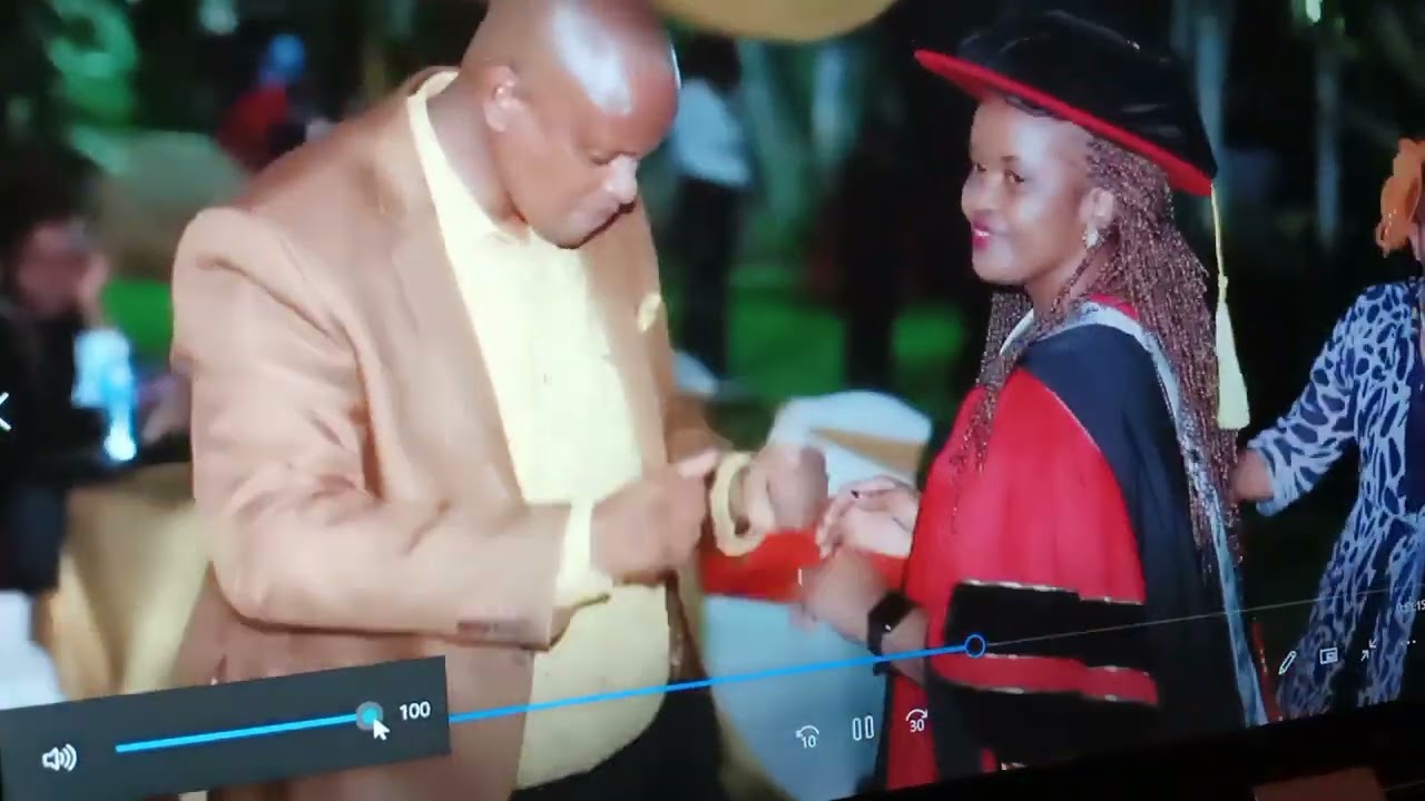 Dr Bubbly Charita Cake cutting on her PhD graduation