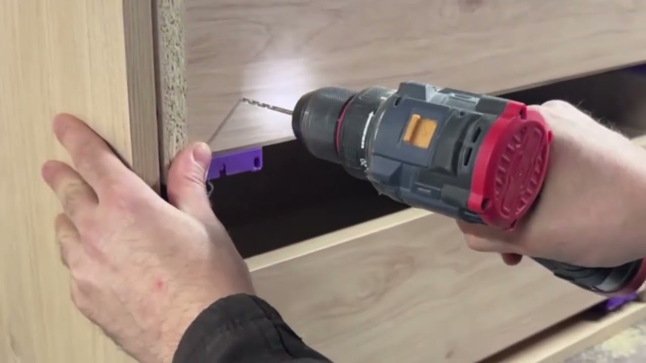 Installing drawers into the module.