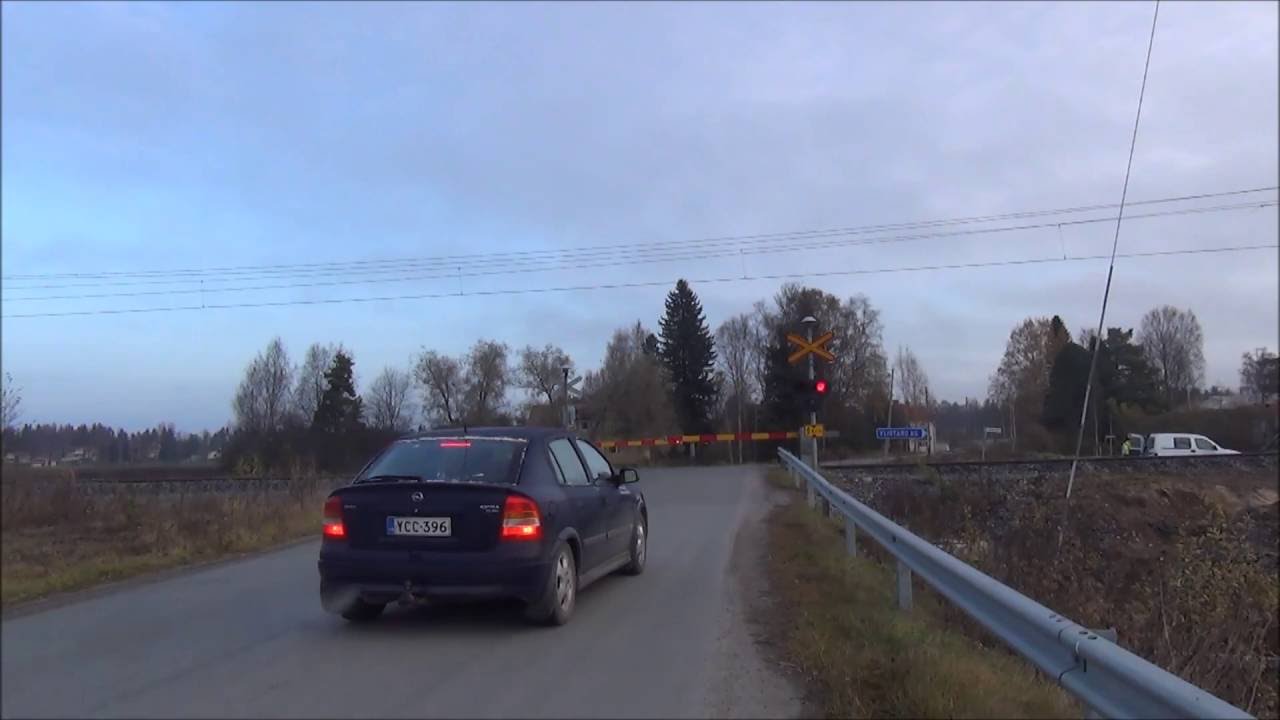 Pendolino 46 passes Aseman ylik. level crossing