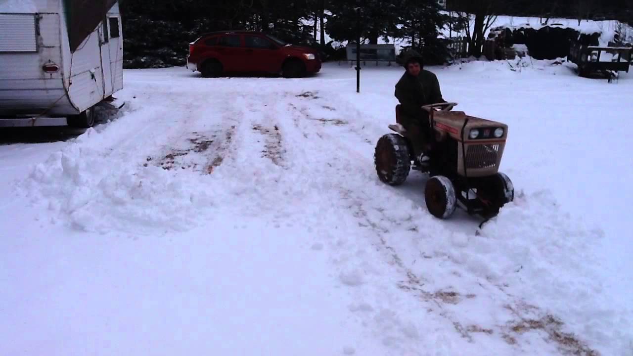 Plowing Snow with a Bolens 1050 and gravel / snow blade