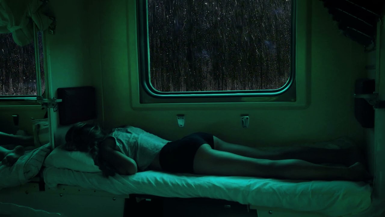 Taking the train on a rainy day | Sleeping in cozy train cabin with rain falling on the train window