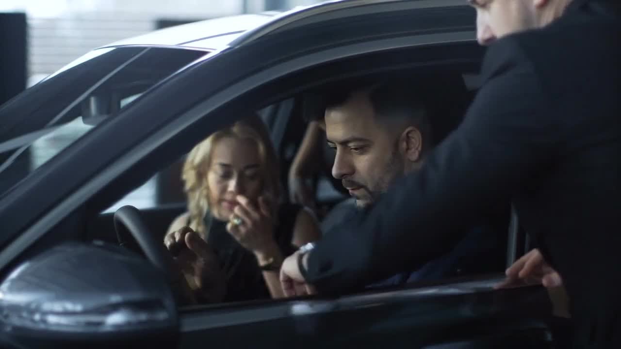 Family Consulting With A Dealer Stock Video