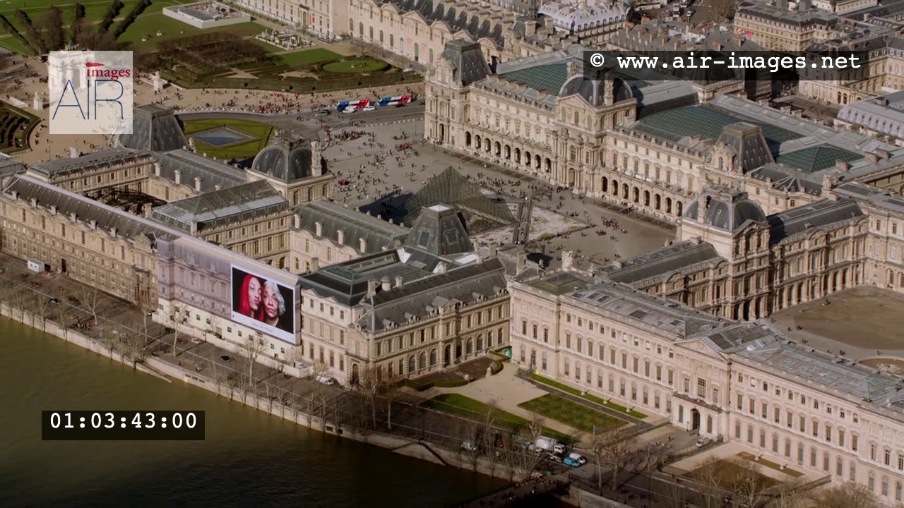 Aerial Footage Paris The Louvre Museum and the river Seine / The Invalides