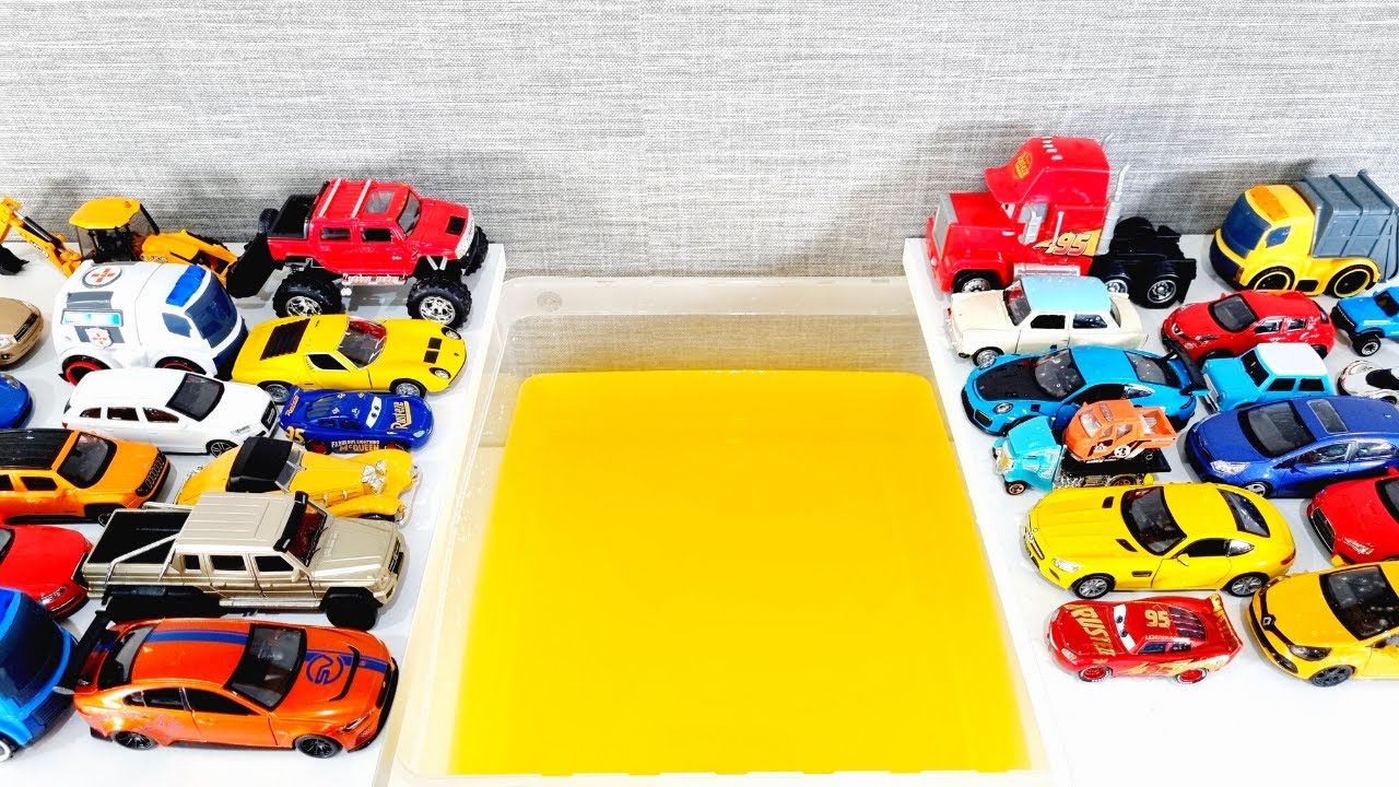 Various Cars Moving And Falling Into Yellow Water