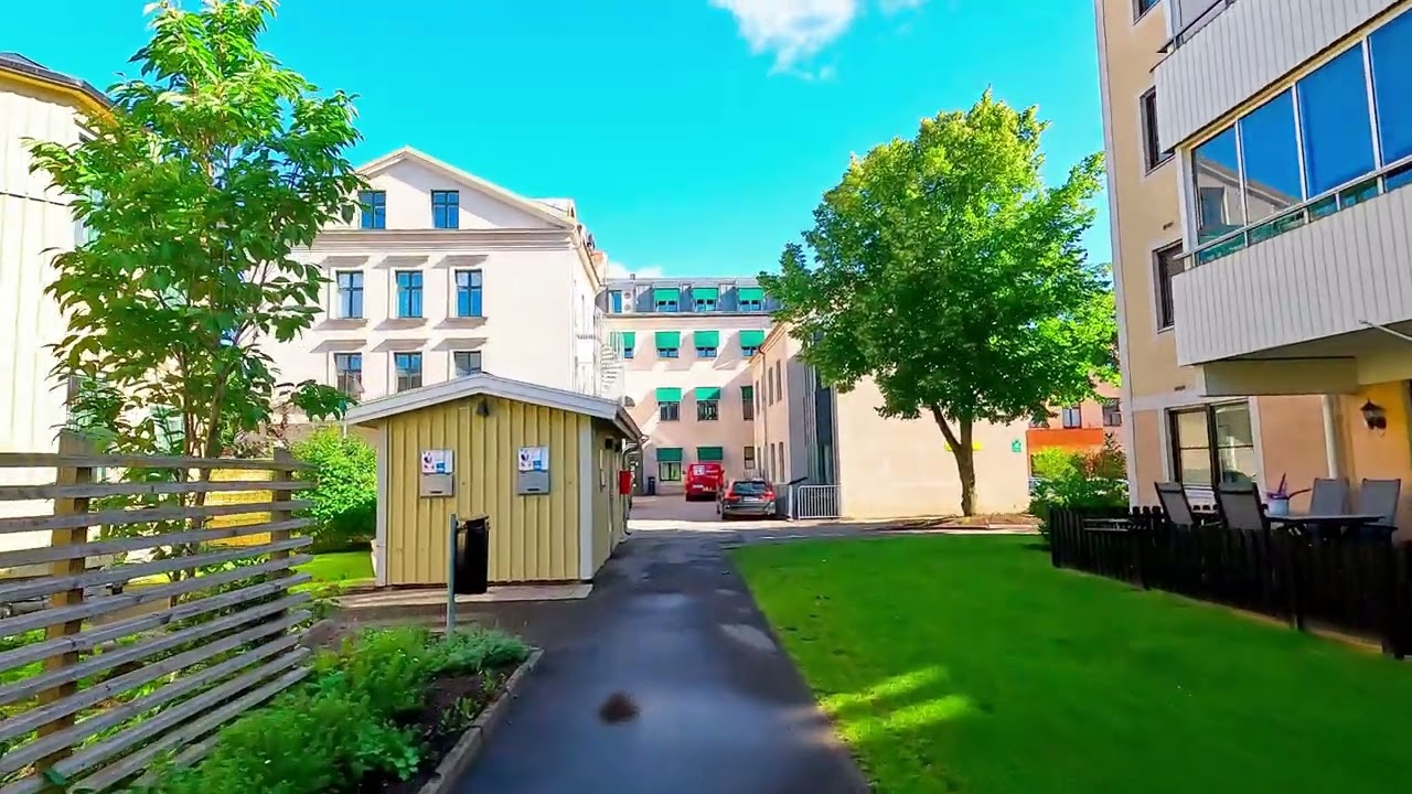 Skövde walks around and looks at nice houses on a summer morning 4k