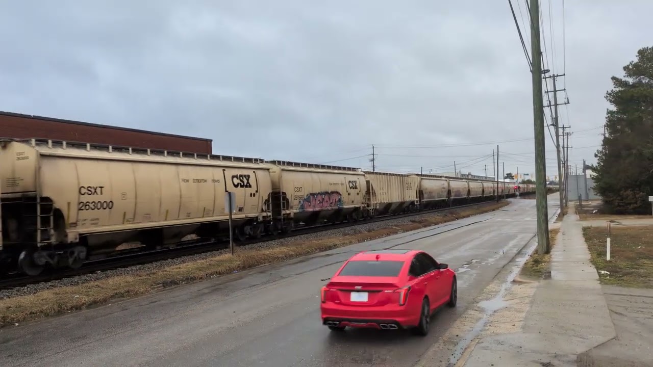 CSX 757 and CSX 5315 lead a south bound grain train through downtown Fayetteville 2/15/2026