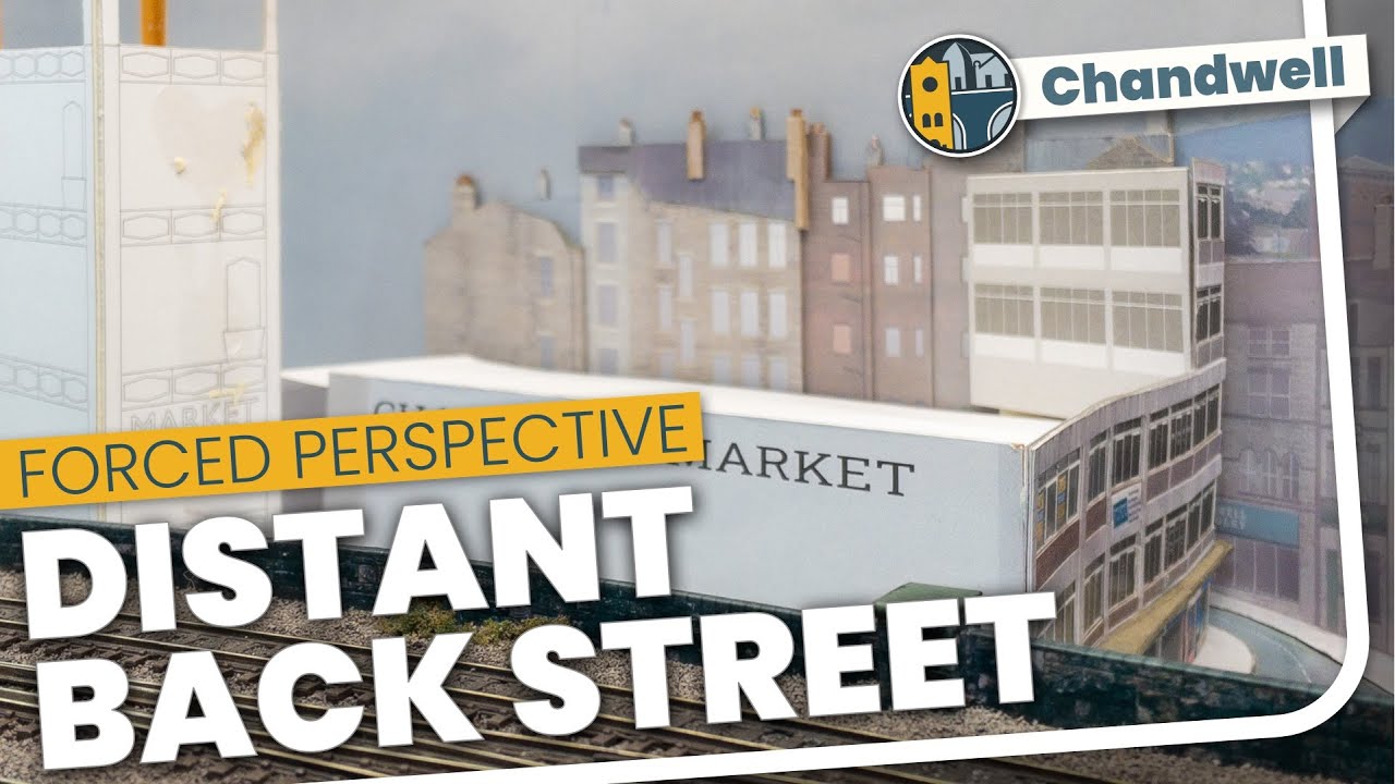 Does this work? A distant back street made of layers of card - model railway backscene
