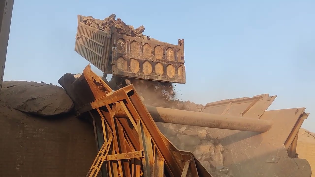 Fully Trolley load up stone dump into crusher: biggest Stone breaking with jaw