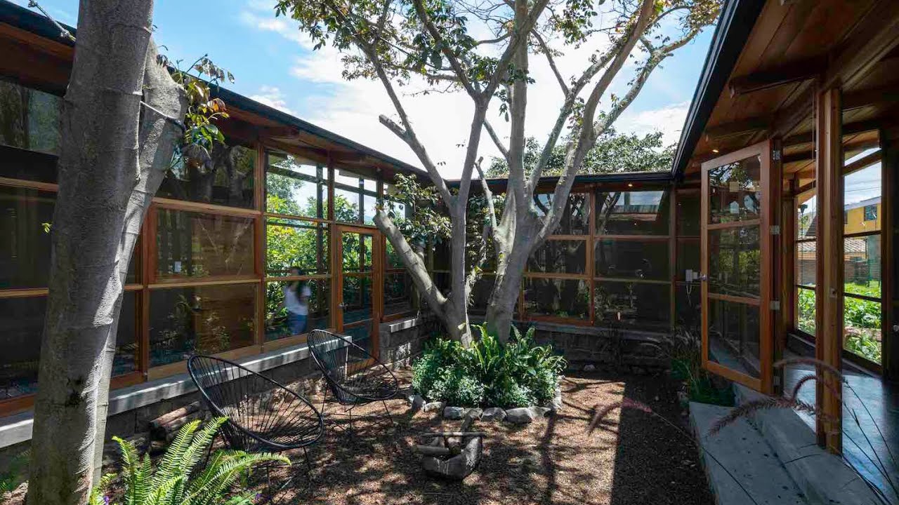 House among trees in Cumbayá, Ecuador designed by El Sindicato Arquitectura