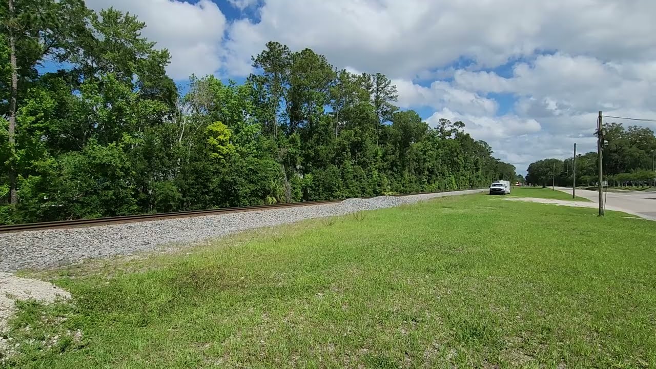 Florida East Coast 905 with FEC 431 flies through Jacksonville FL