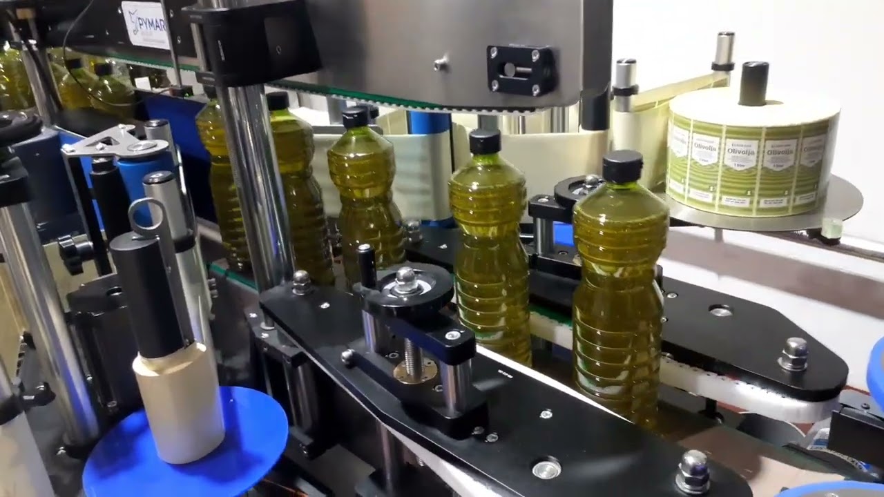 Etiquetadora de botes de aceite doble cara y envolvente | Grupo PYMAR