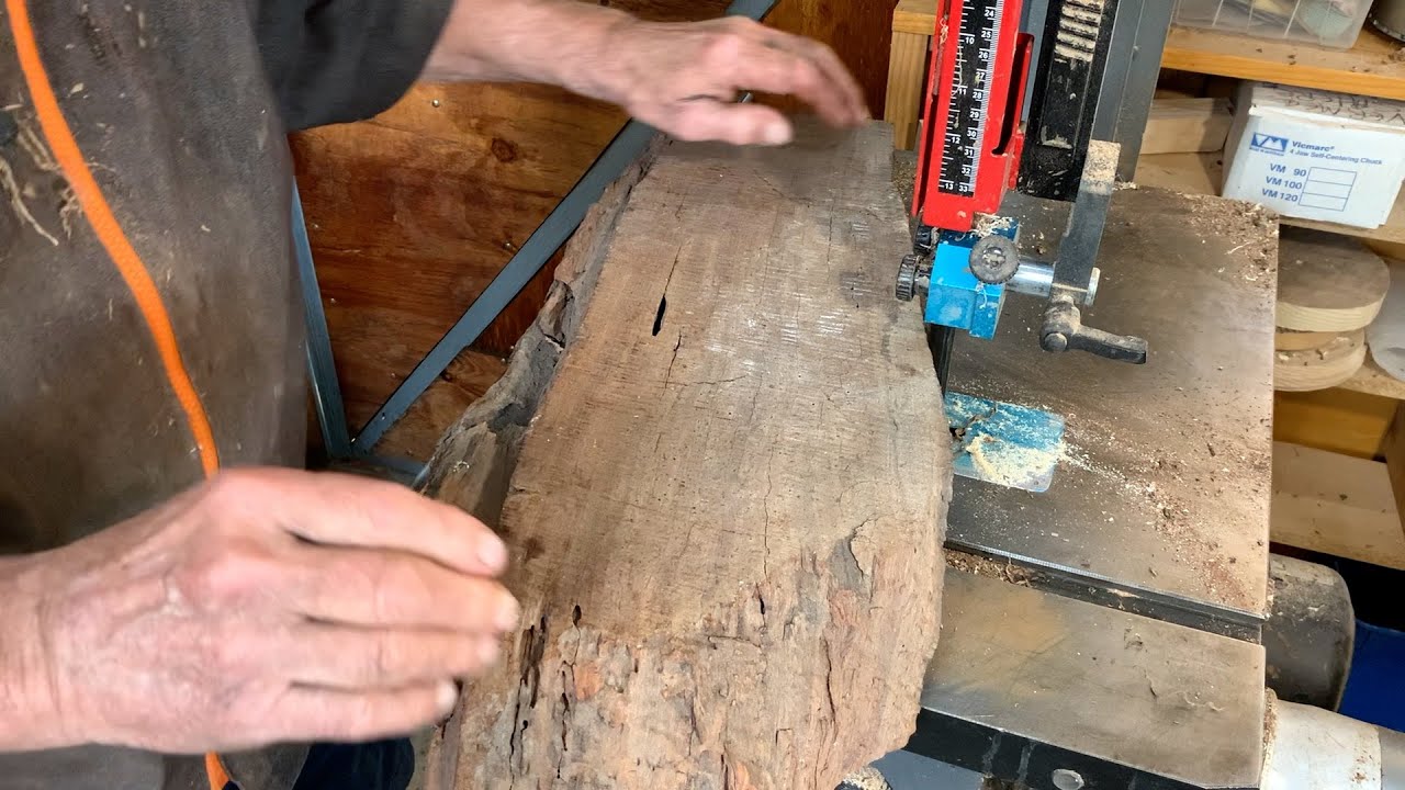 Richard Raffan cuts woodturning blanks from wormy fissured redgum firewood.