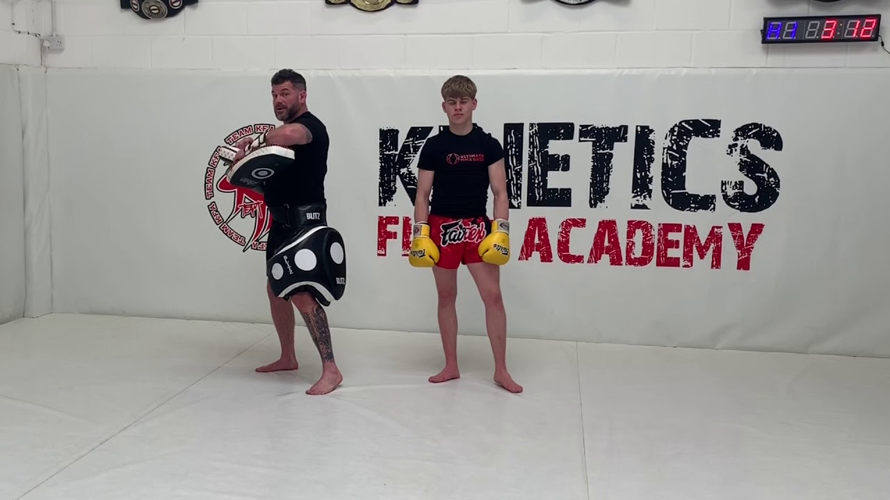 Muay Thai pad combo jab - cross - body punch - left hook - knee - elbow