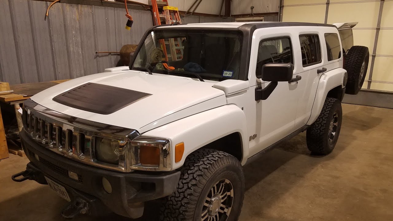 Restoring the Hummer H3 windshield pillars to black with a heat gun