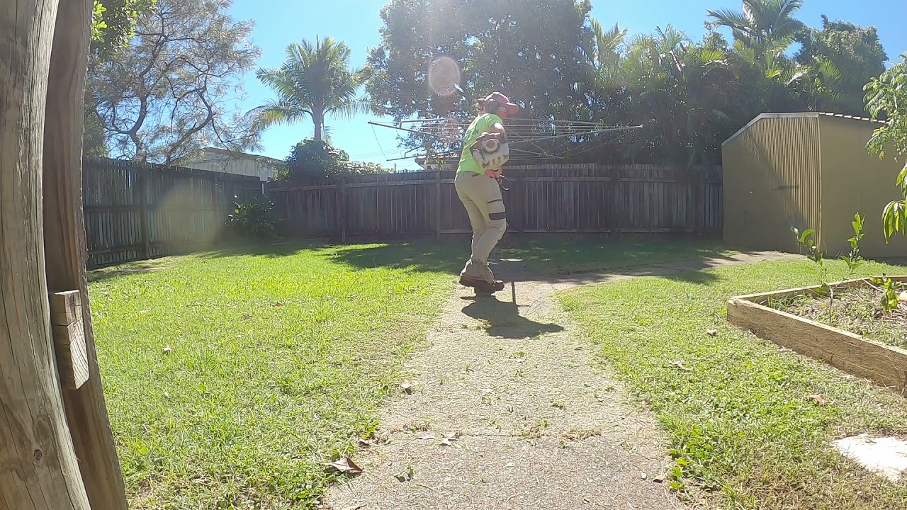 Whipper snipping  / brush cutting / line trimming cleaning up a path edge with STIHL FS240