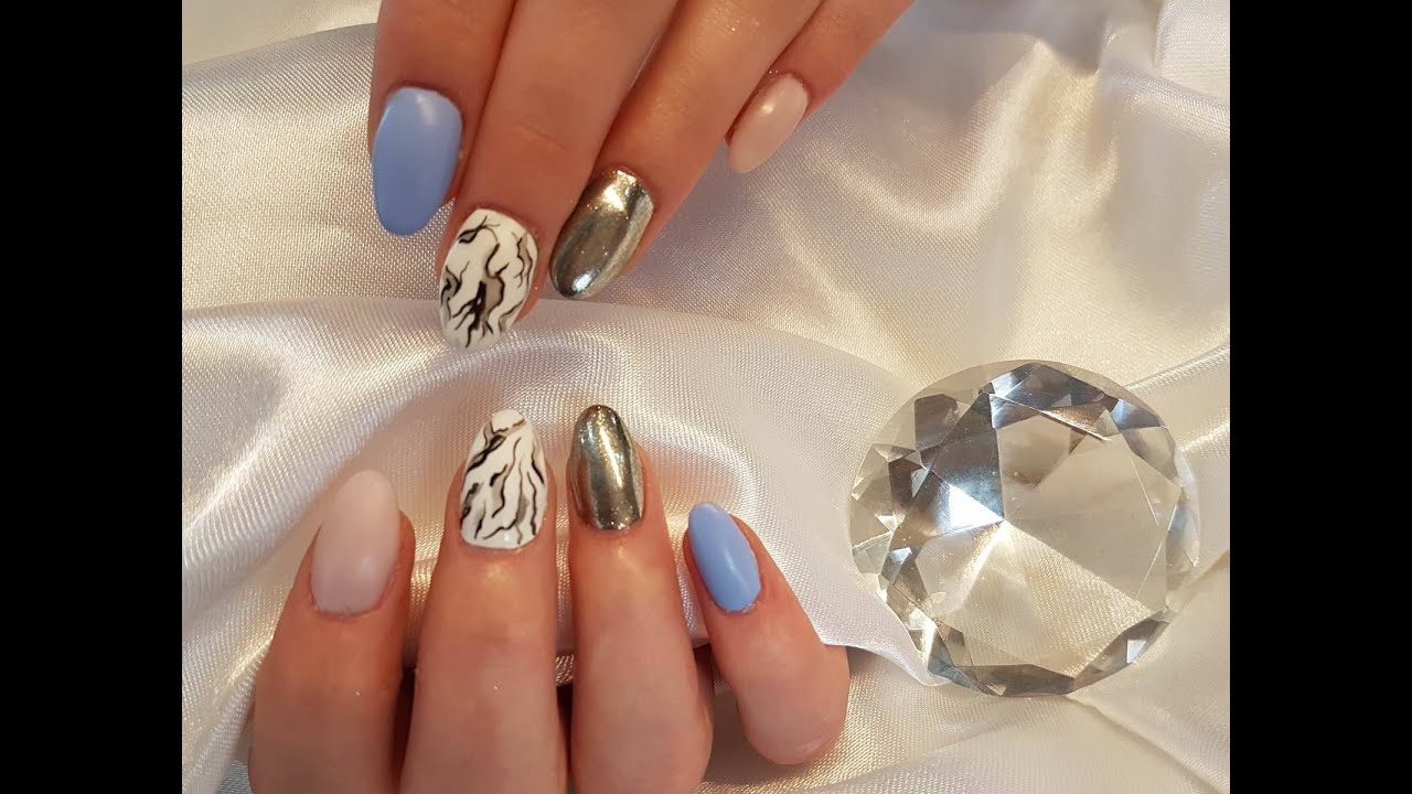Sculpted almond gel nails. Gel extensions on forms. Mirror chrome nail art and marble. Almond nails