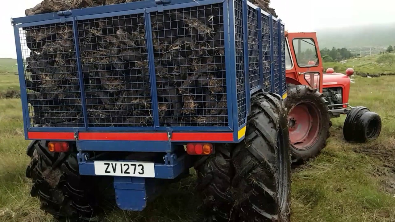Massey Ferguson 35x with land drive trailer