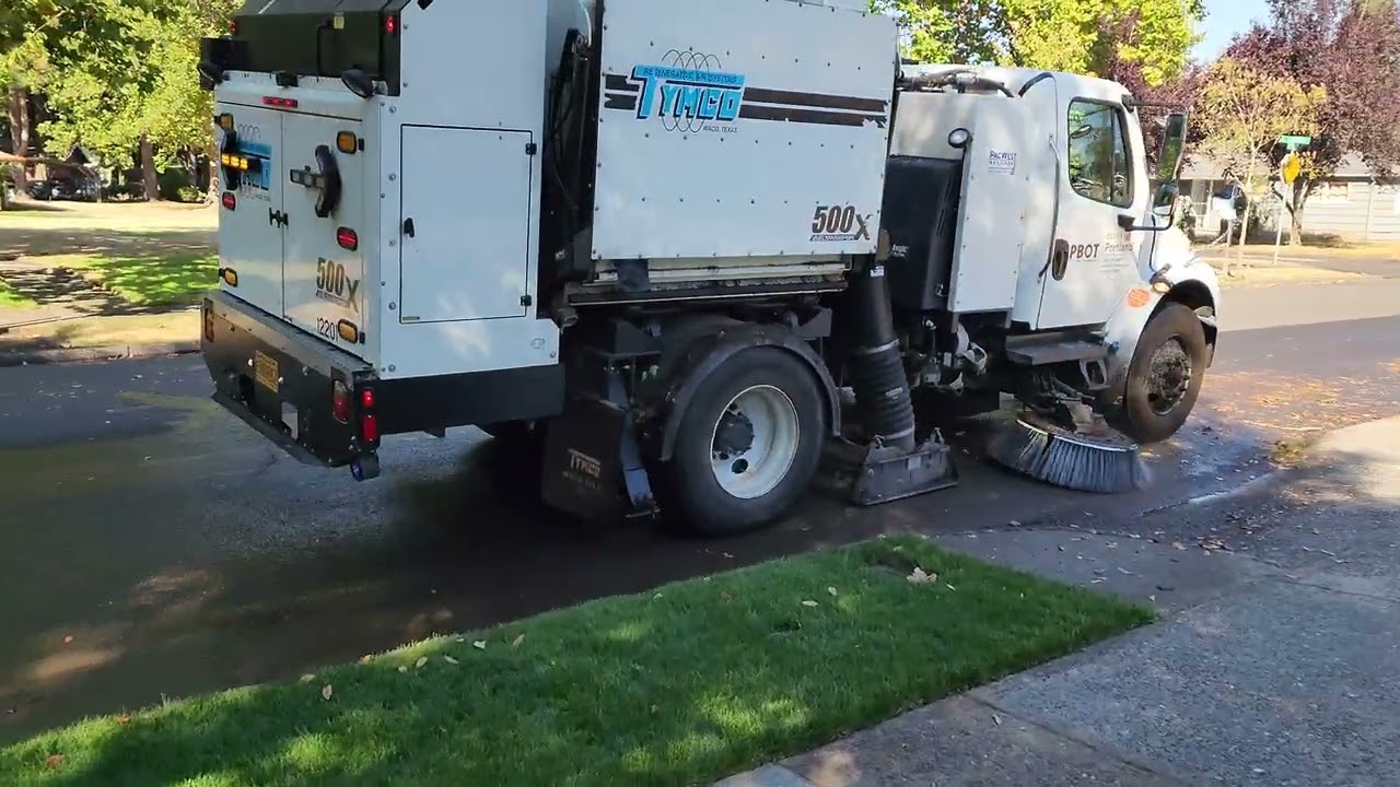 Street sweeper cleaning street