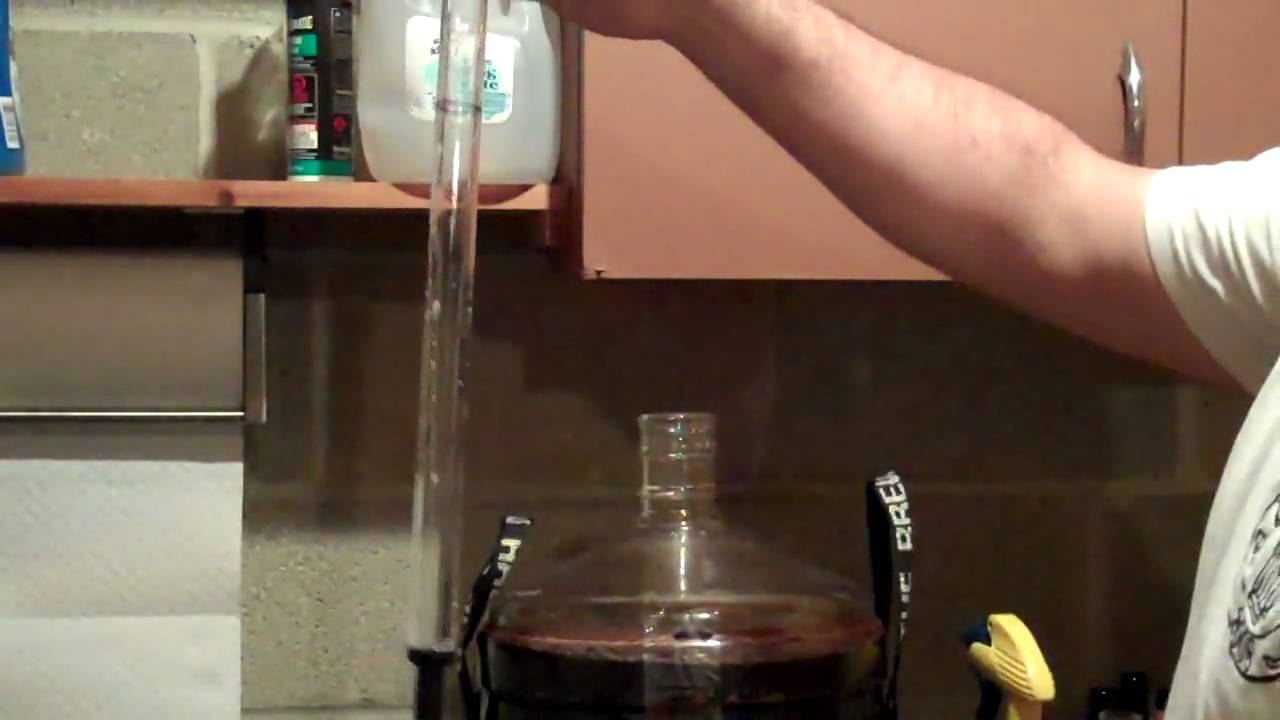Taking a beer sample using a wine thief and hydrometer