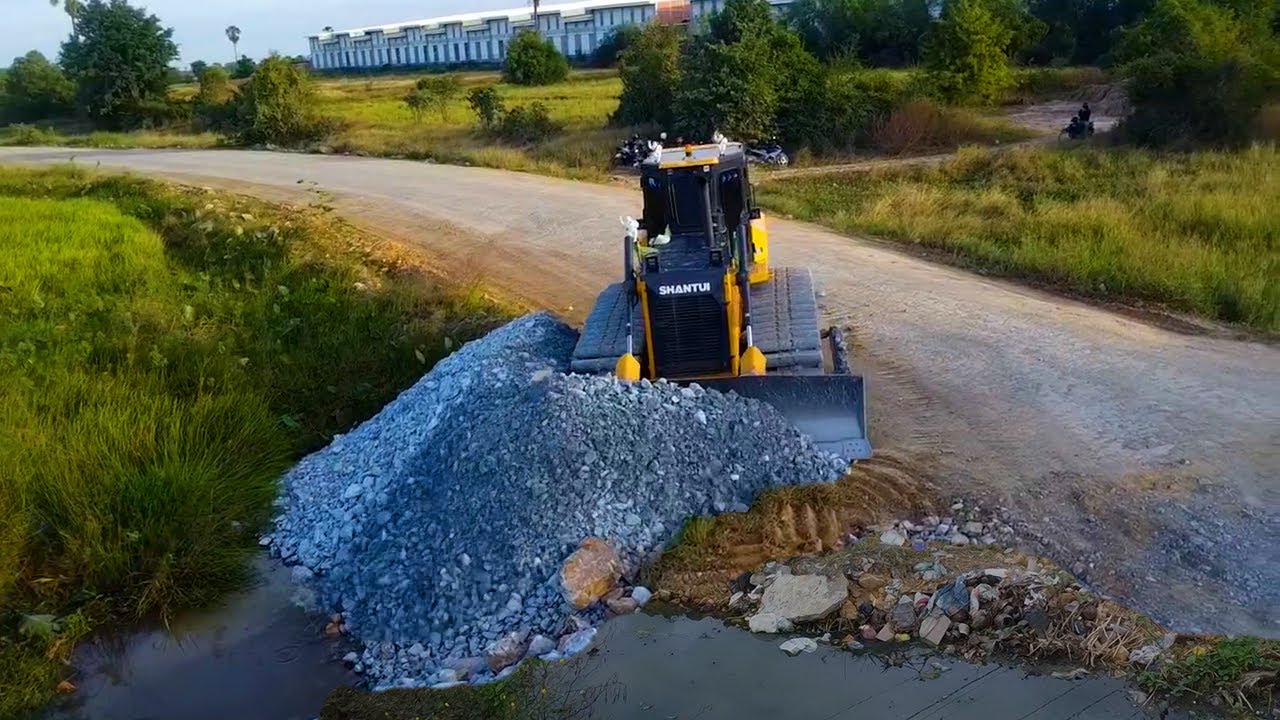 Start up new step delete pond huge repair land by SHANTUI DH17 C3 pour stone with dump truck