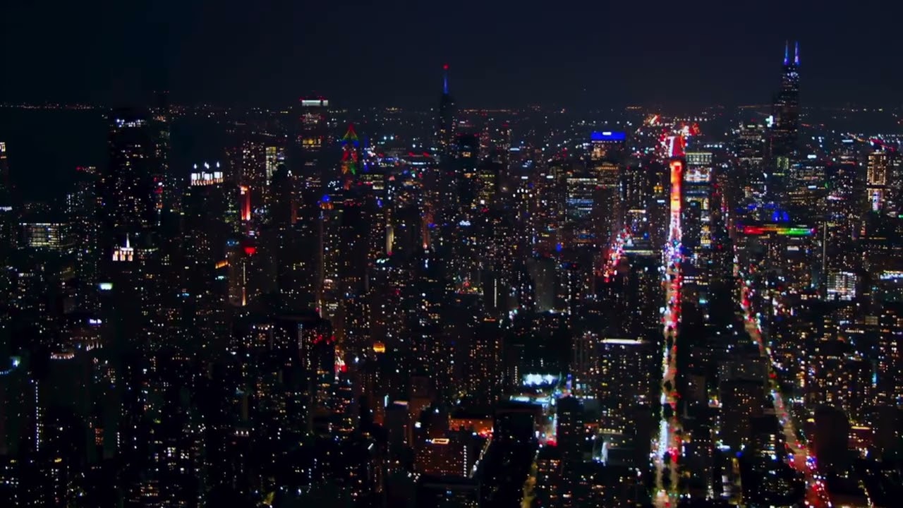 Chicago Skyline at Night skyscrapers and glowing street lights that highlight 