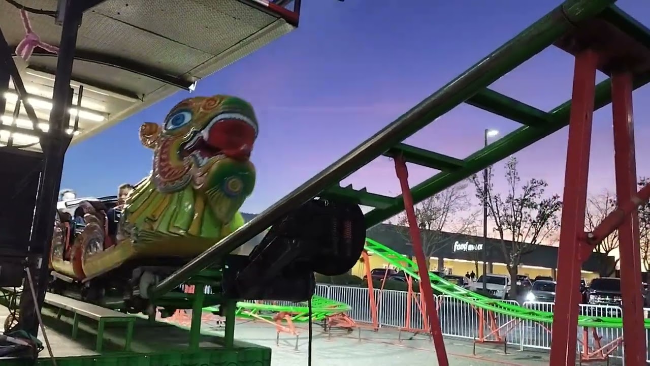 Kiana and Isabella riding on The Magical Dragon roller coaster at the carnival☺️🎢🐲🐉