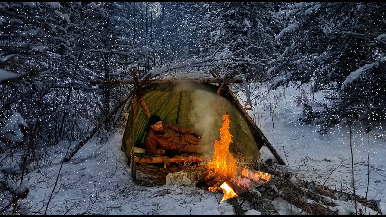 How not to freeze to death in the Wild forest in winter. Bushcraft shelter and campfire for survival