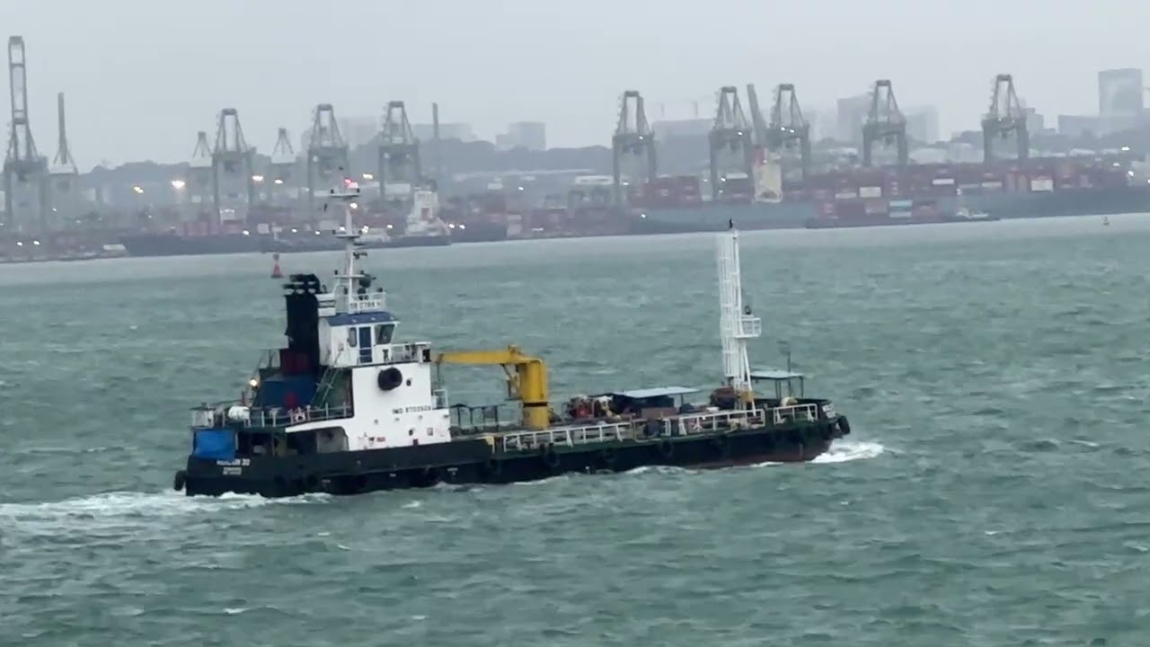 Small boat approaching Harbour | busiest harbour  Singapore | wind and swell | container jetty 