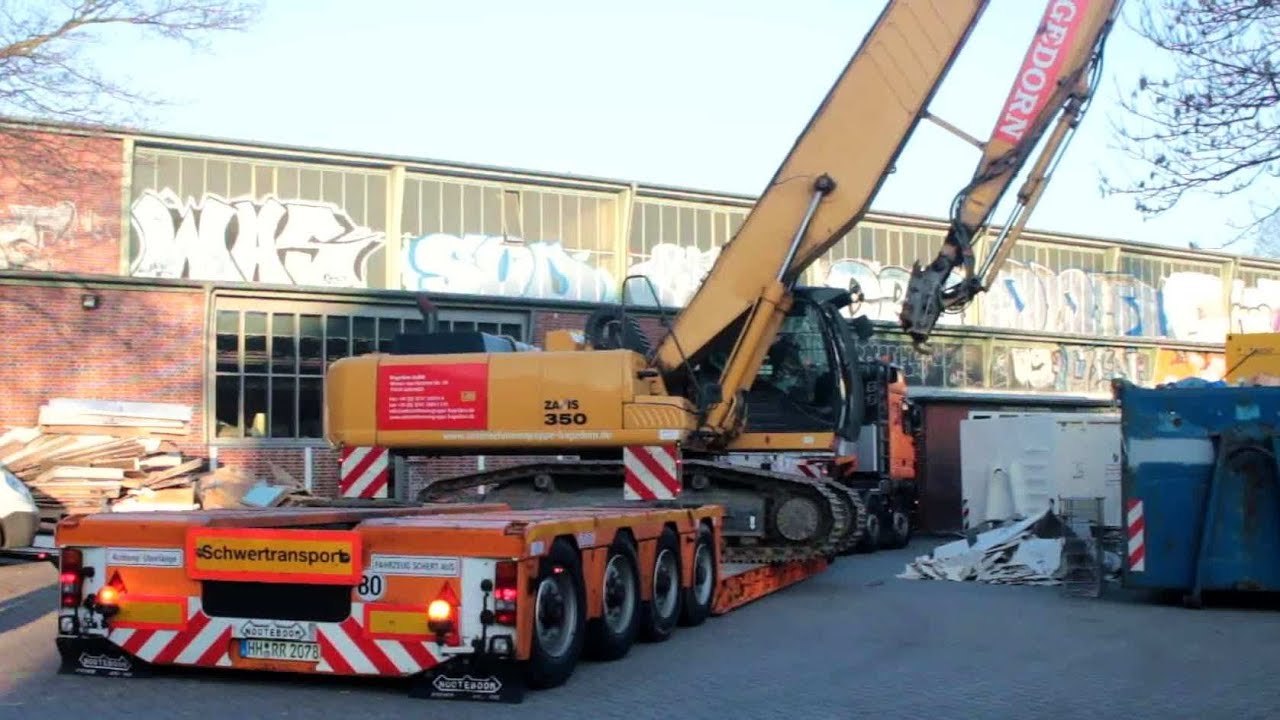 Hitachi Zaxis 350 crawler excavator with demolition boom unloading by side for demolition job