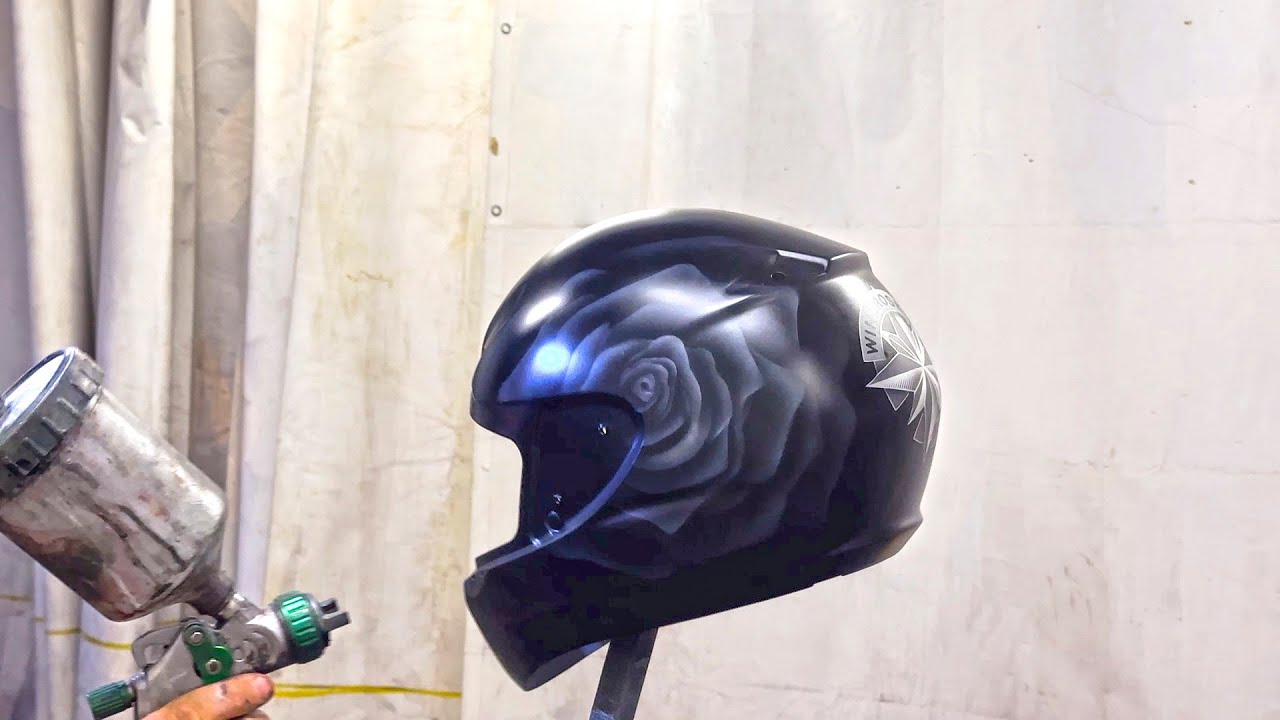 Airbrushing shadowed white rose on a helmet