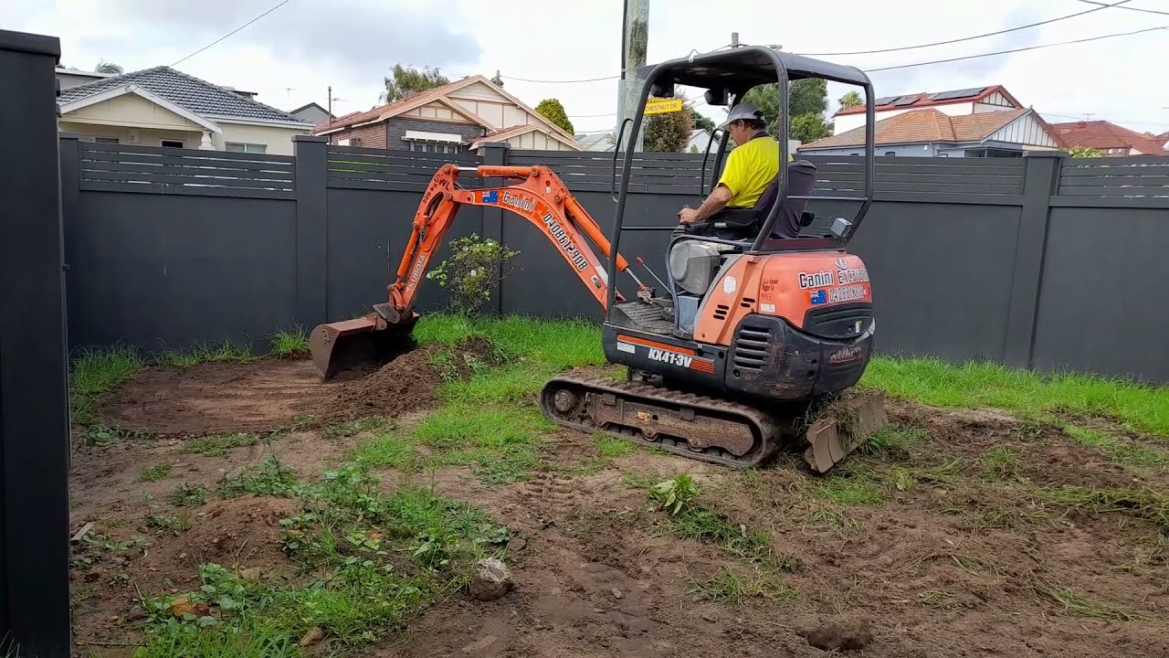 Kubota Excavator Tight Access Excavation removing lawn
