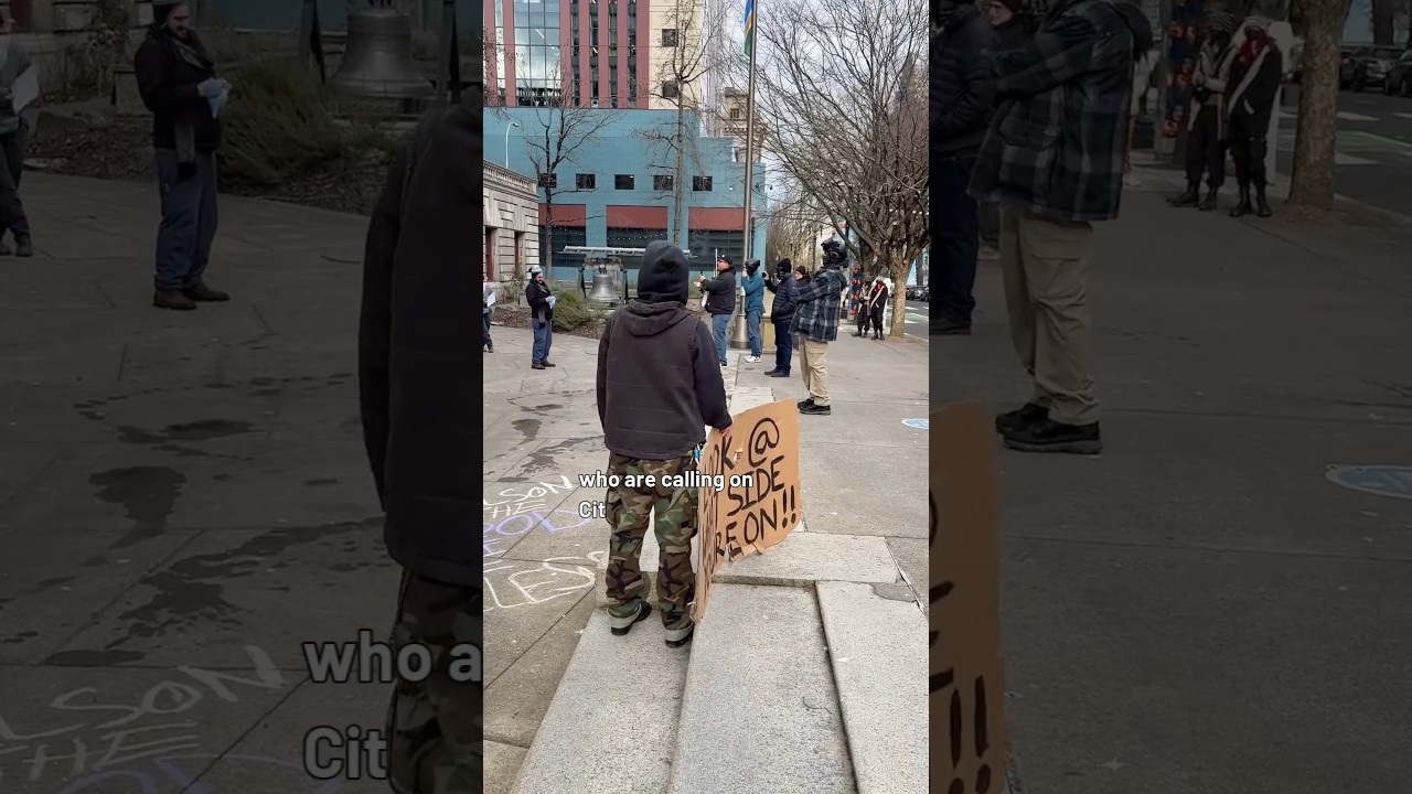 Protesters and Counter-Protesters clash during a rally at City Hall against ICE in Portland.