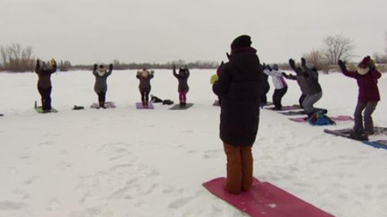 Yoga Lovers Bundle Up For a Wintery Class on Icy Pond