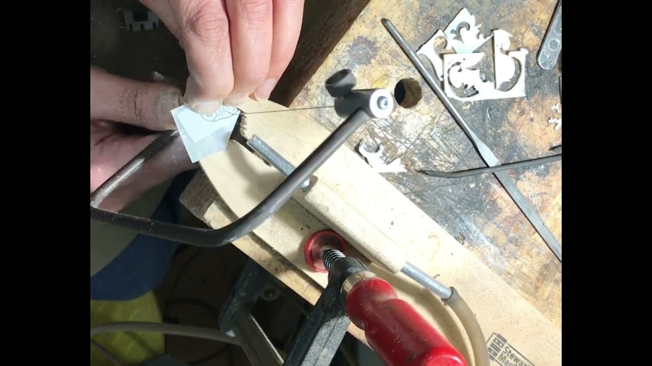 Cutting out pearl inlay at Hutchings Banjos