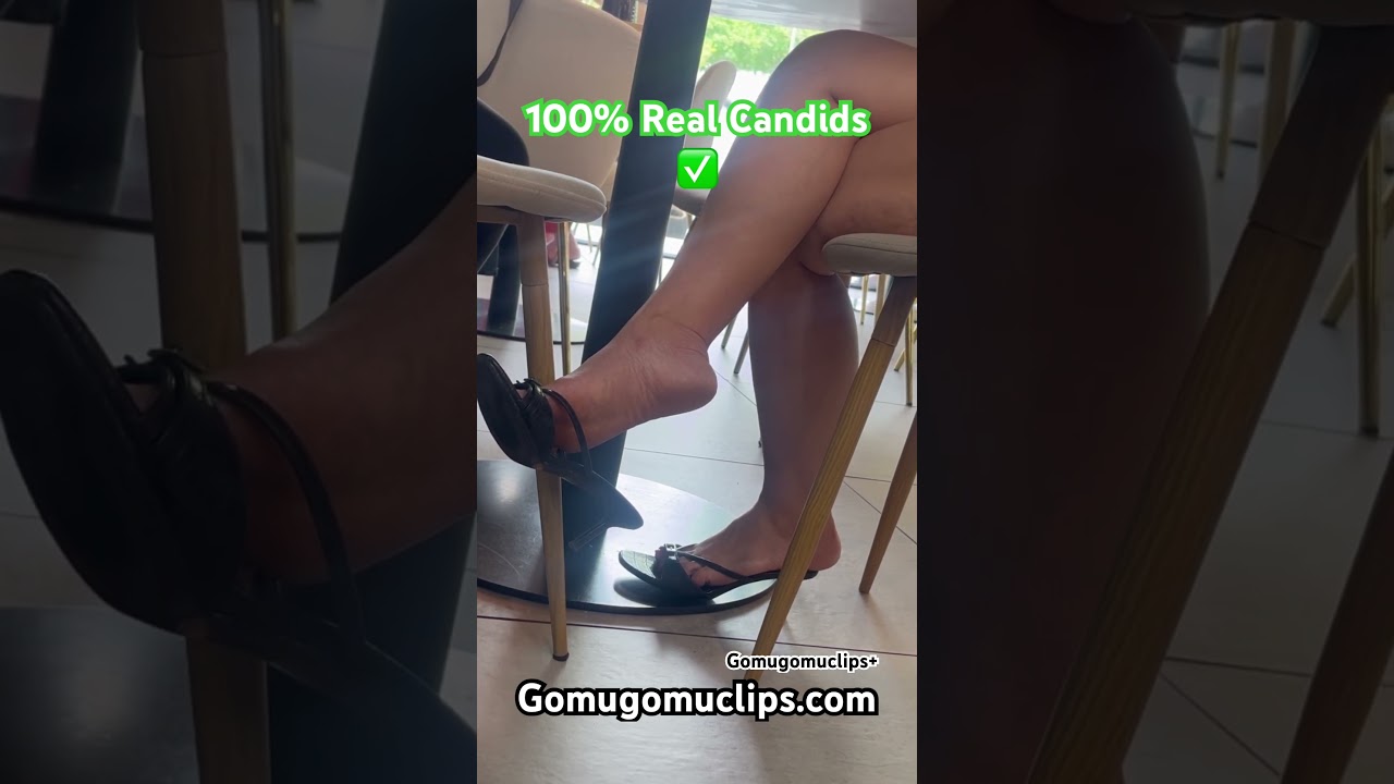 Candid Asian lady dangling heels off 