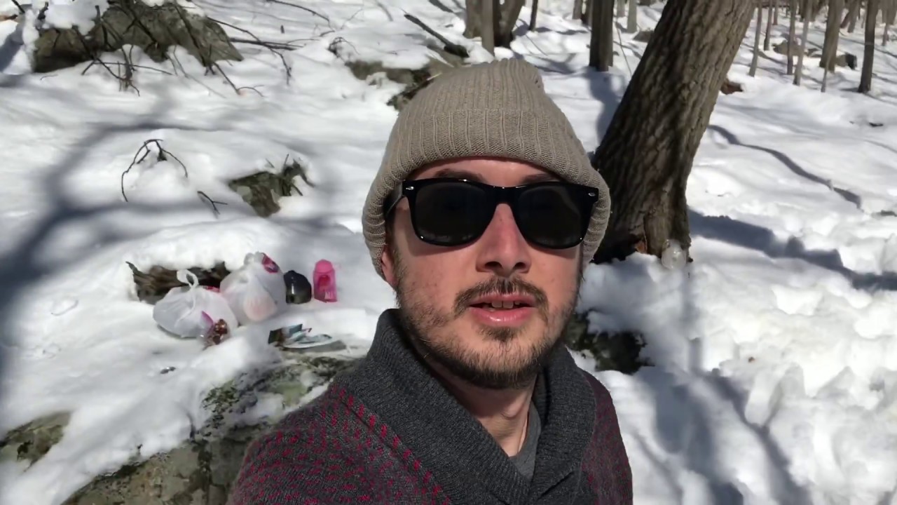 Winter camping in the snow and roasting Cornish hens over a fire