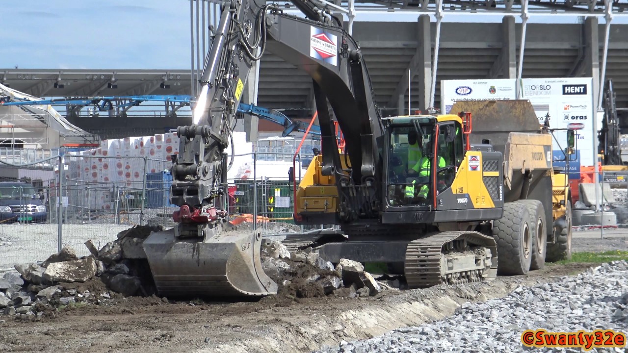 4K| Volvo EC300E Moving, Piling & Loading Rocks On Volvo A25E